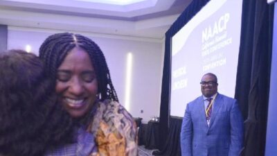 Oakland City Councilwoman Treva Reid receives a passionate hug after her speech during the NAACP's Political Luncheon on Oct. 28, 2023 - CBM photo by Antonio Ray Harvey