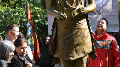 The family of Miwok leader and cultural preservationist William &ldquo;Bill&rdquo; Franklin stands in front of the California Native American Monument in Capitol Park. The monument, created in the likeness of Franklin, is the first to honor Native American people on the grounds of the State Capitol. Nov. 7, 2023. CBM photo by Antonio Ray Harvey.
