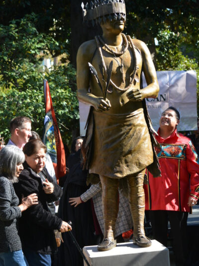 The family of Miwok leader and cultural preservationist William &ldquo;Bill&rdquo; Franklin stands in front of the California Native American Monument in Capitol Park. The monument, created in the likeness of Franklin, is the first to honor Native American people on the grounds of the State Capitol. Nov. 7, 2023. CBM photo by Antonio Ray Harvey.