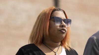 Deja Taylor and attorney (Billy Schuerman-The Virginian-Pilot-AP)