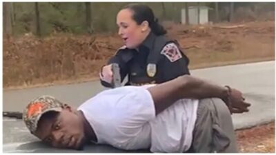 Reform police officer using stun gun on handcuffed man