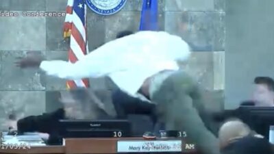 Deobra Redding basically flies over Judge Mary Kay Holthus' desk to attack her - screenshot