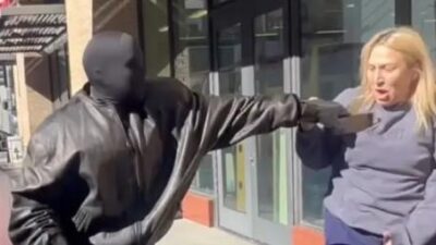 Kanye West grabbing phone from TMZ reporter - screenshot