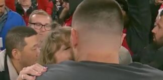 Taylor Swift and Travis Kelsey kiss on field - screenshot