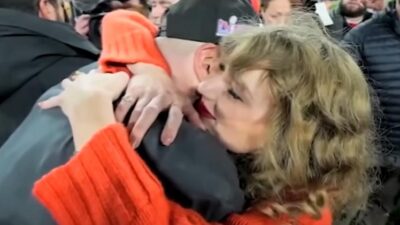 Taylor Swift hugging Travis Kelce - (screenshot)