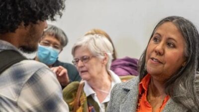 Native American Victoria Ferguson speaking to a student at the &lsquo;1872 Forward: A Celebration of Virginia Tech&rsquo; event, held in partnership with the More Than a Fraction Foundation. (Photo: Rodney Kimbangu)