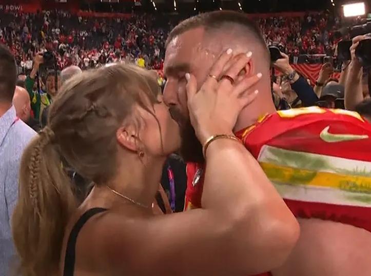 Taylor Swift kisses Travis Kelce after Super Bowl win (photo via NFL)