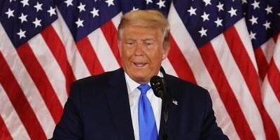 Donald Trump - flag in rear