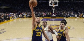 Steph Curry going to the hoop against Lakers (Ashley Landis-AP via CNN Newsource)