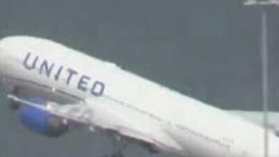United Airlines plane losing tire during takeoff from SFO - screenshot
