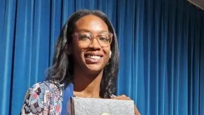 Attorney Kamilah Moore of the California Reparations Task Force holds he 1075-page report