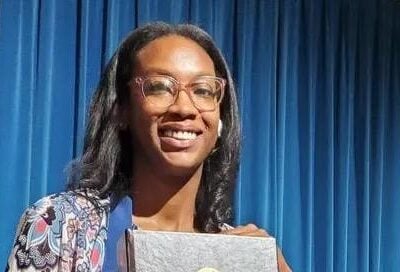 Attorney Kamilah Moore of the California Reparations Task Force holds he 1075-page report