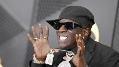 Flavor Flav showing off iced clock (Lionel Hahn-Getty Images via CNN Newsource)