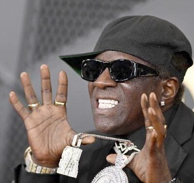 Flavor Flav showing off iced clock (Lionel Hahn-Getty Images via CNN Newsource)