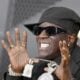 Flavor Flav showing off iced clock (Lionel Hahn-Getty Images via CNN Newsource)