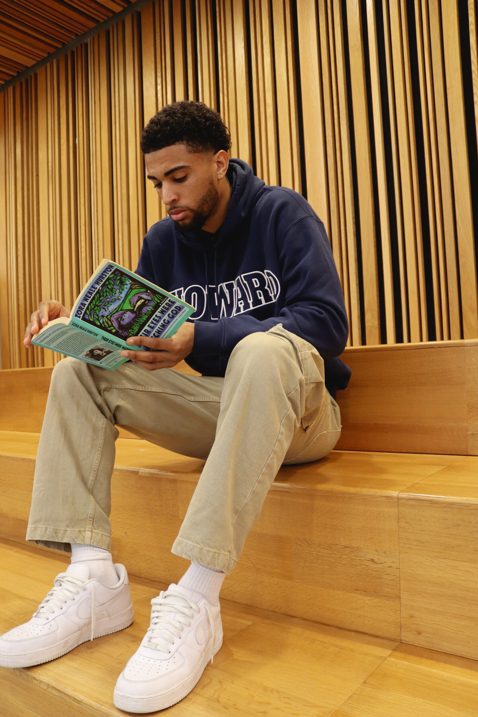 Seth Towns, 26, at The Martin Luther King Jr. Memorial Library in Washington, D.C. reading one of his Top 3 books, "Their Eyes Were Watching God" by Zora Neale Hurston.