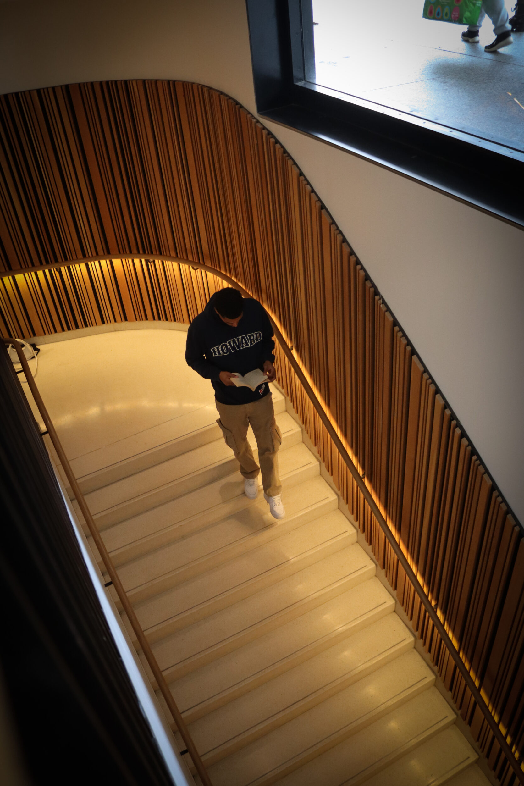 Seth Towns, 26, at The Martin Luther King Jr, Memorial Library. He gets lost in the pages of the story, as he creates his own.Photos by Harmony Bailey