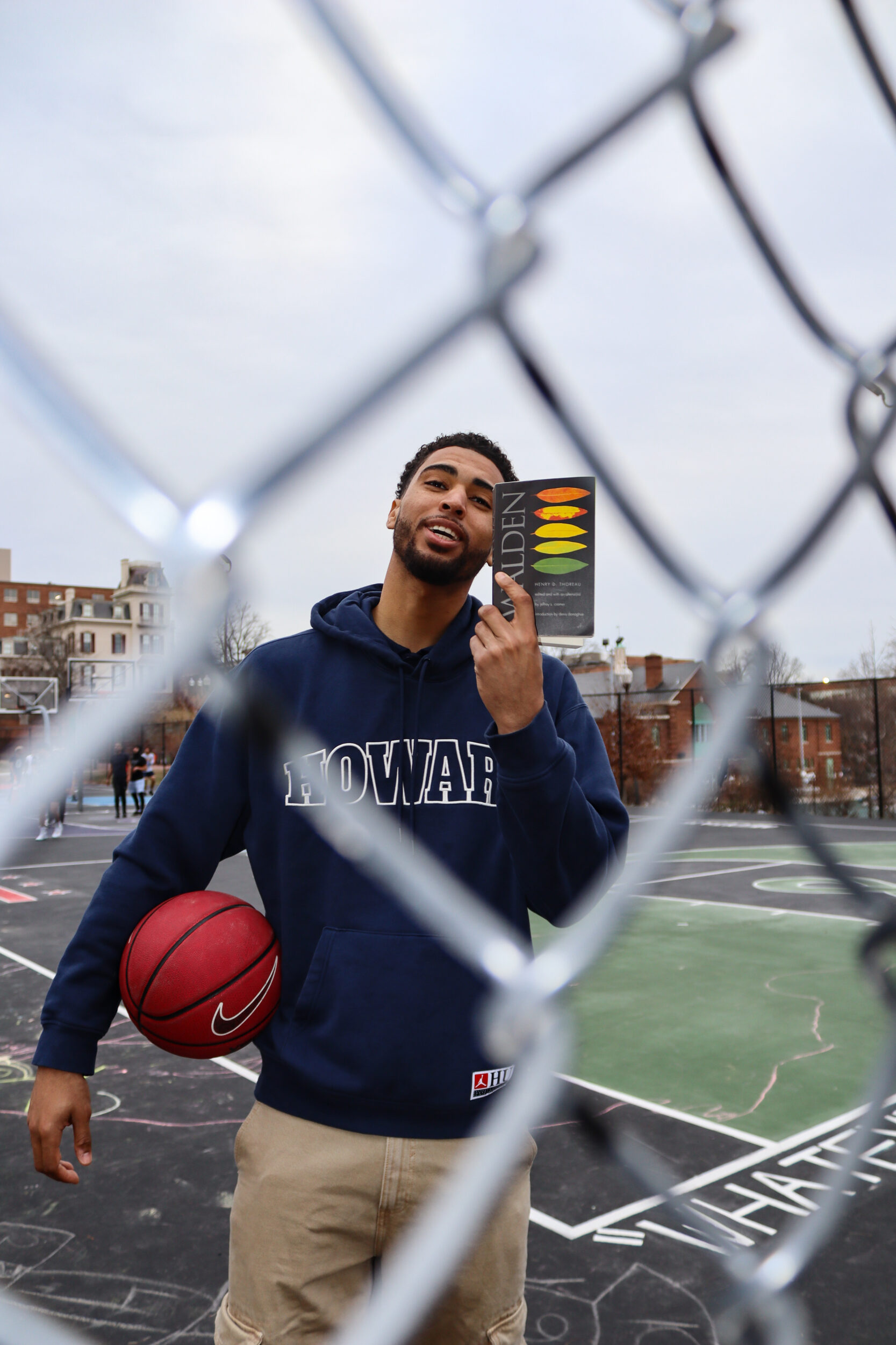 Seth Towns, 26, at The Banneker Recreation Center basketball courts recommending you all the book "Walden" by Henry David Thoreau.Photo by Harmony Bailey