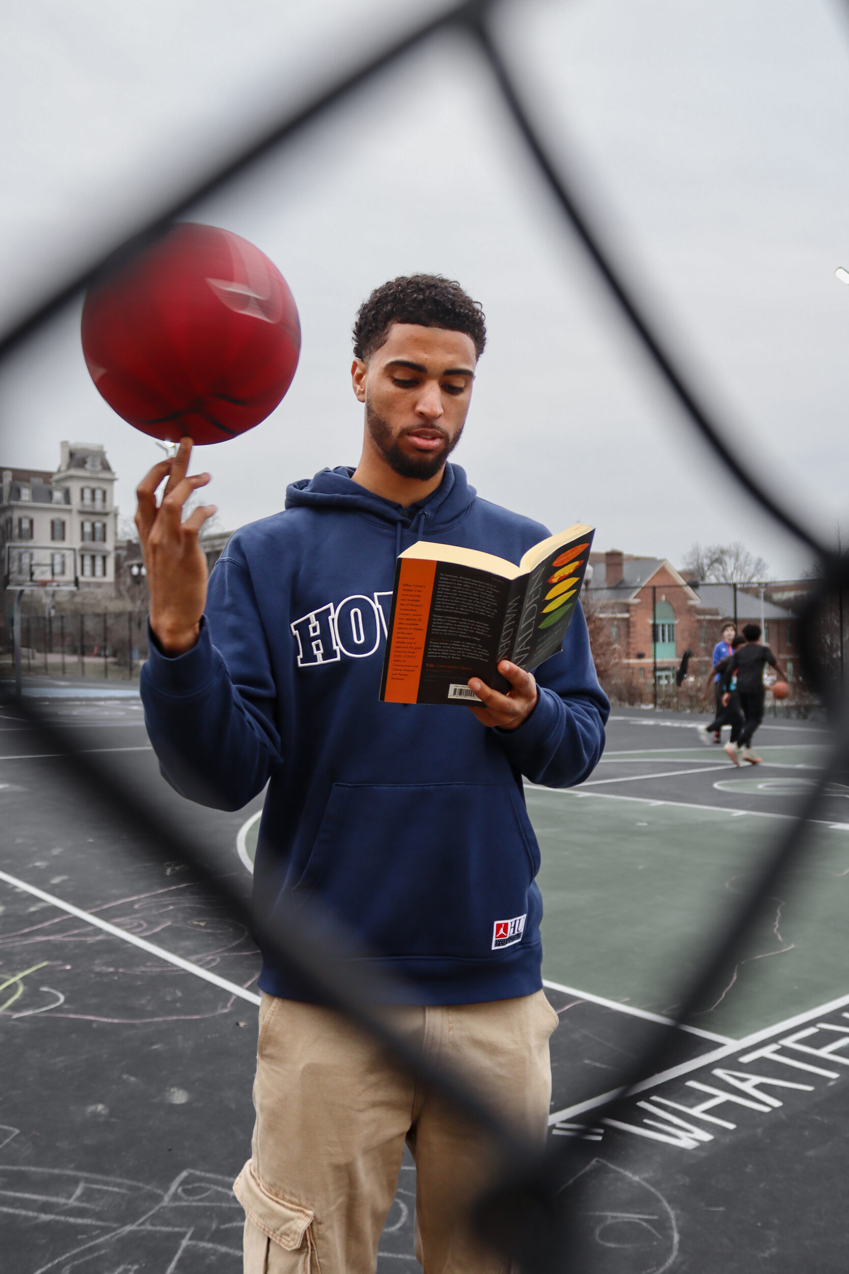 Seth Towns, 26, exercising some of his many talents, at The Banneker Recreation Center basketball courts, on the campus of Howard University.Photo by Harmony Bailey