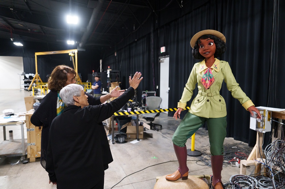  (L to R) Walt Disney Imagineering executive Carmen Smith shows Tiana audio-animatronic to Stella Chase Reese whose mother Leah Chase served as a key source of inspiration for Princess Tiana character in Walt Disney Animation Studios’ “The Princess and the Frog.” Tiana’s Bayou Adventure attraction is coming to Walt Disney World Resort in Florida this summer 2024 and Disneyland Resort in California later this year.
