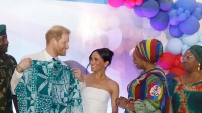 Bare-armed Meghan Markle and Harry in Nigeria - Getty