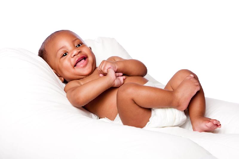 Black infant (wearing diaper) - Depositphotos