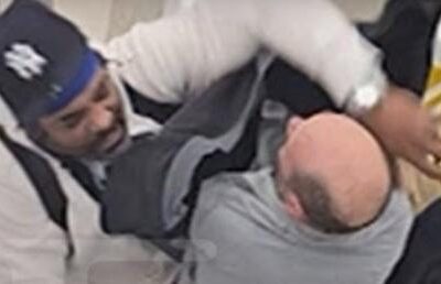 Jim Jones airport escalator fight - v ia TMZ screenshot