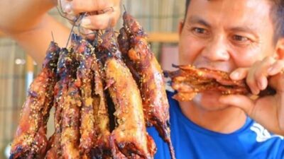 Man eating rat meat - screenshot