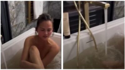 Chrissy Teigen removes body makeup in bath