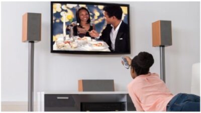 Black woman watching television