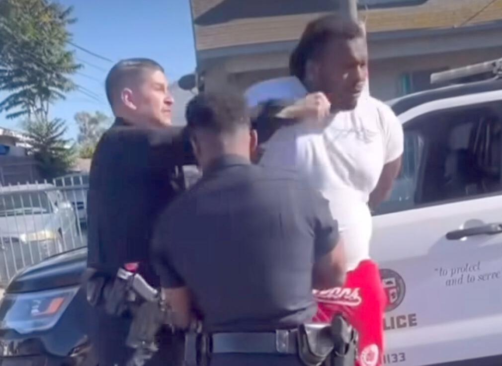 Alexander Donta Mitchell injured after LAPD confrontation in Watts // Alexander Donta Mitchell (handcuffed) punched by LAPD officer - screenshot