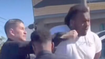 Alexander Donta Mitchell (handcuffed) punched by LAPD officer - screenshot