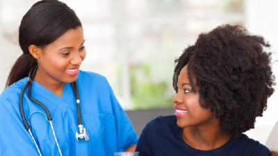Black woman patient and doctor - Depositphotos