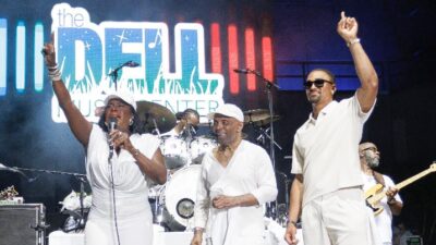 Frankie Beverly stands alongside Mayor Cherelle Parker and Philadelphia Eagles' quarterback Jalen Hurts / Photo: KDMorris