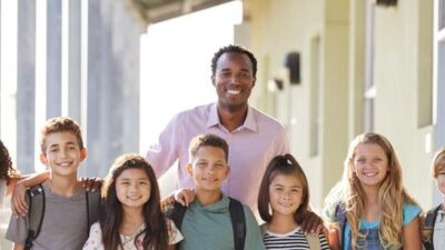 Back to School (teacher and students) - Depositphotos