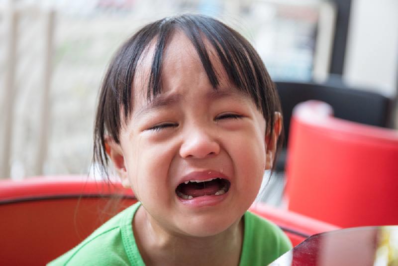 Passengers lock crying grandchild in plane toilet // Crying child - Depositphotos