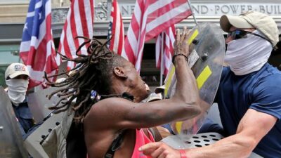 Patriot Front and Black man in confrontation - GettyImages