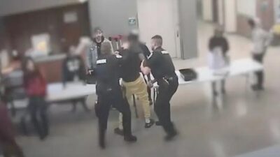 White school resource officer hits Black student in head - screenshot