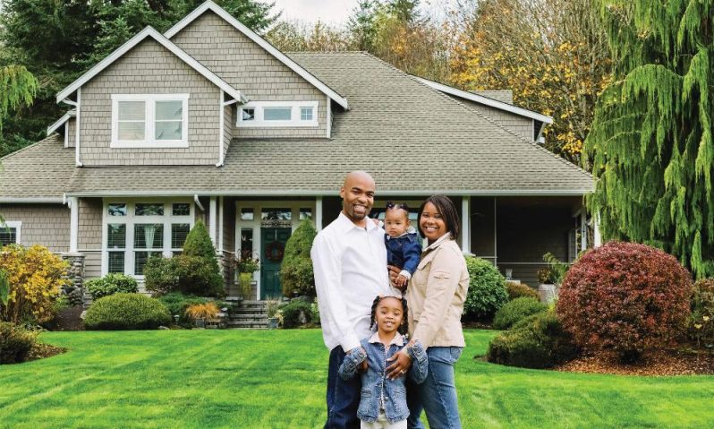 Hidden Housing Costs Ranked in 342 U.S. Cities // Black Family in front of new home