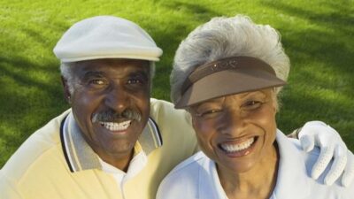 Fit Looking Senior Black Couple golfing - Depositphotos