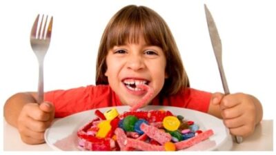 kid eating candy