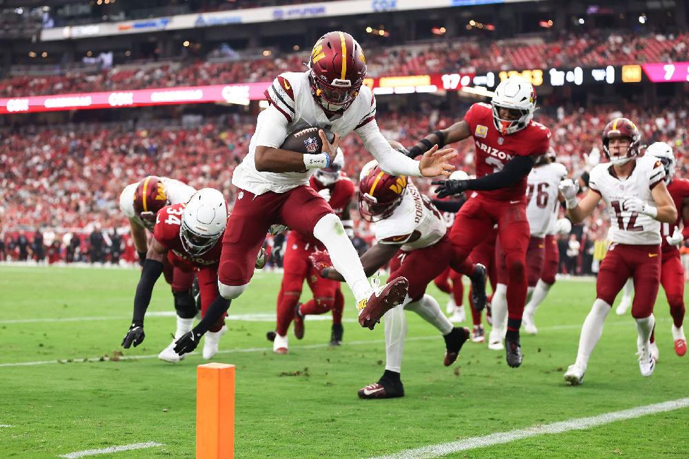 Jayden Daniels Proves He&rsquo;s More Than Just the NFL's No. 2 Pick // Jayden Daniels scoring touchdown (Christian Petersen-Getty Images via CNN Newsource) 