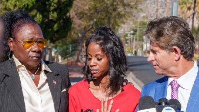 Left to Right: Civil Rights Attorney Caree Harper comforts the victim&rsquo;s mother as she becomes emotional when describing the attacks on her son while her attorney Bradley C. Gage listens - (Solomon O. Smith for CBM