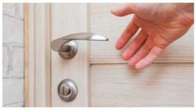 man opening front door