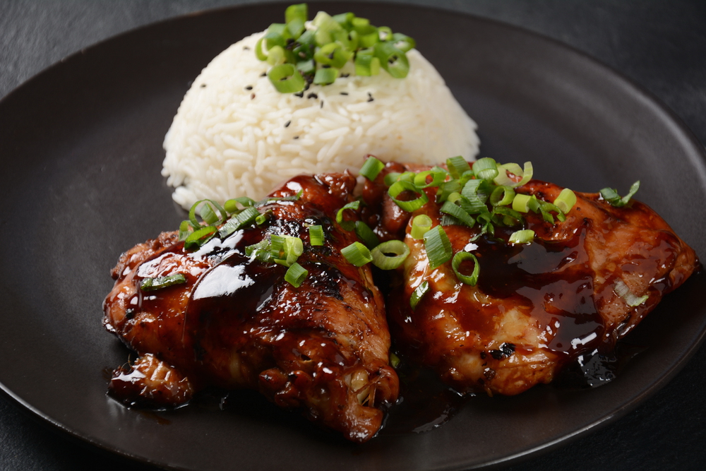 Chicken thighs marinated and cooked in adobo sauce