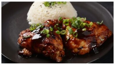 Chicken thighs marinated and cooked in adobo sauce