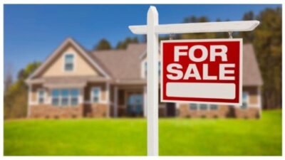 Home For Sale Sign in Front of New House