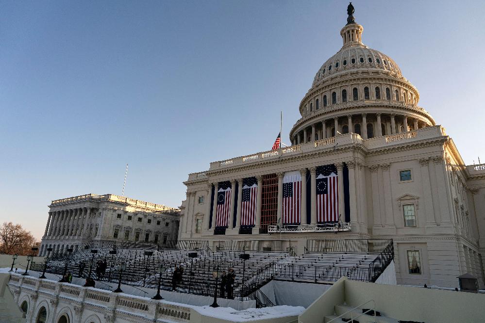 Trump moves inauguration indoors due to extreme D.C. cold // US Capitol Bldg and snow (Al Drago-Bloomberg via Getty Images via CNN Newsource) 