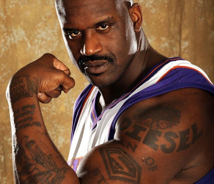 Shaquille O'Neal displaying his Superman tattoo