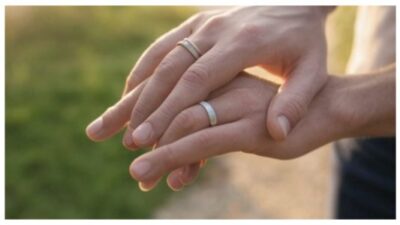 married couple holding hands